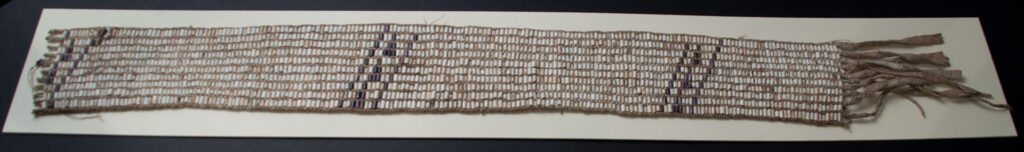 GREENVILLE TREATY WAMPUM BELT OHC Artifact ID#: H50297 Date of Origin: 1795 Composition: Buckskin belt adorned with ten rows of white and black wampum arranged in a diagonal stripe pattern. Significance: This is a wampum belt given by Miami Chief Little Turtle to United States General Anthony Wayne on the occasion of the Treaty of Greenville. Wampum is made from a shellfish found only in the North Atlantic. It was used to adorn items of religious or political importance. The patterns formed by the shells can even encode messages. Wampum belts were often sent by couriers as a message of war or peace among the tribes. They were often exchanged at treaty negotiations to solemnize the agreements. The Treaty of Greenville established a firm border for the future State of Ohio, while preserving a corner of the state for Indian use. It ended a period of warfare that had lasted for ten years and laid the foundation for white settlement in the Midwestern states. General Wayne died in 1796 at Erie, Pennsylvania. Little Turtle passed away near Fort Wayne Indiana, only four days before the War of 1812 was declared.
